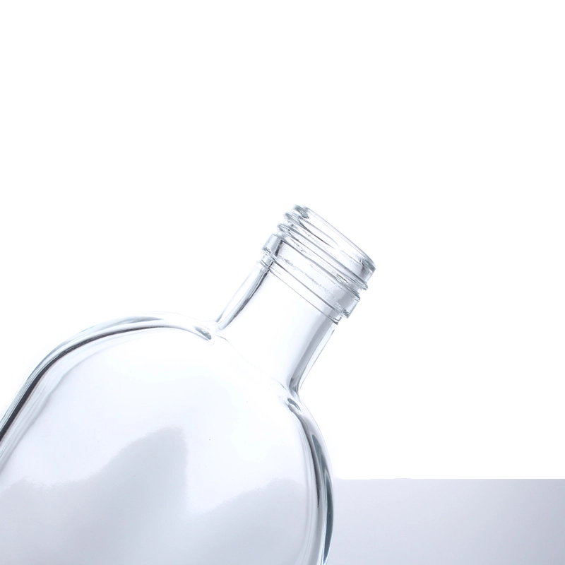 transparent glass water bottle